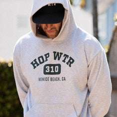 Person wearing a grey HOPWTR 310 Venice Beach hoodie